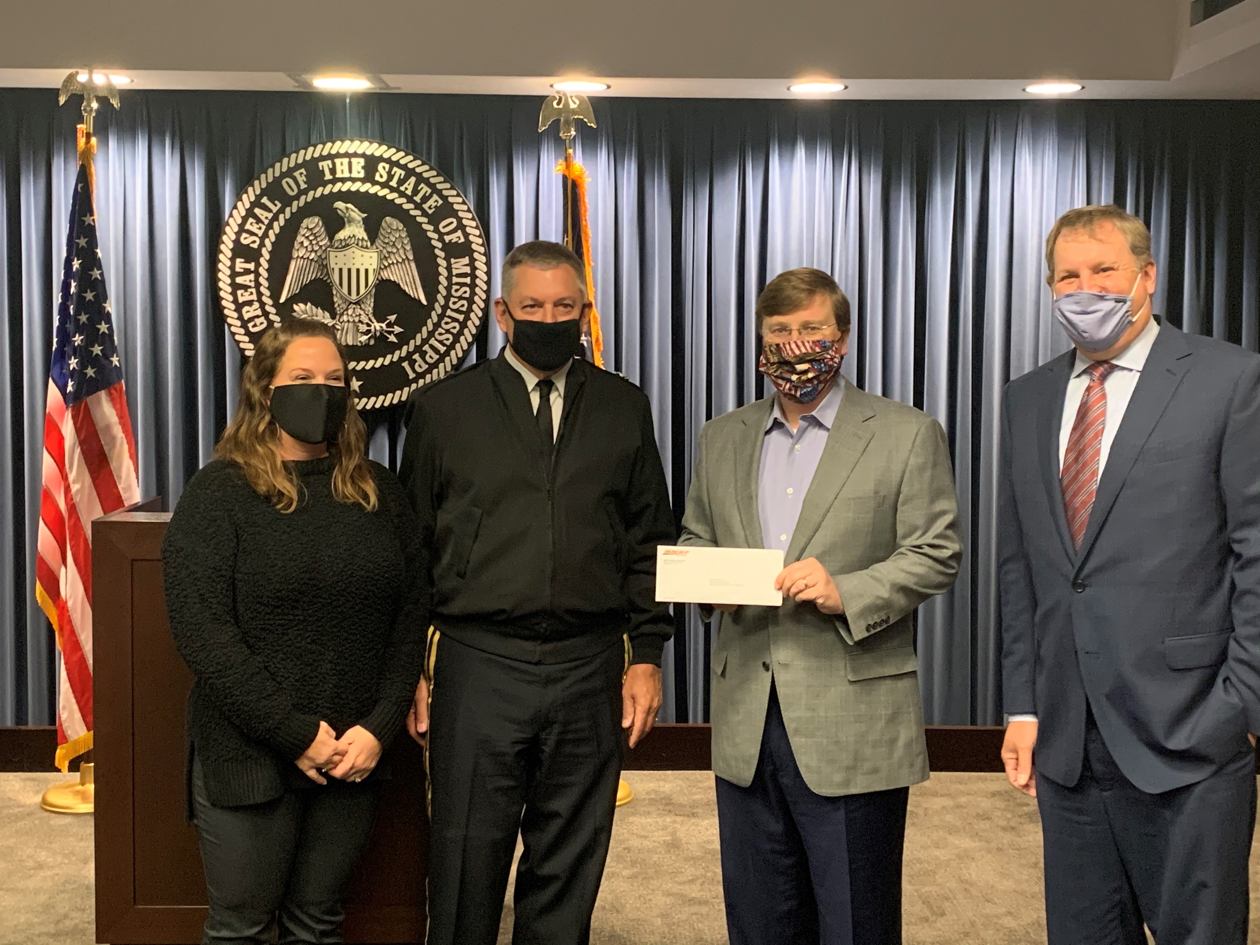 From left to right: Kristina Frazier, Family Support Programs and Mississippi National Guard; Mississippi Adjunct Gen. Janson Boyles; Mississippi Gov. Tate Reeves and BNSF’s Michael Garriga.