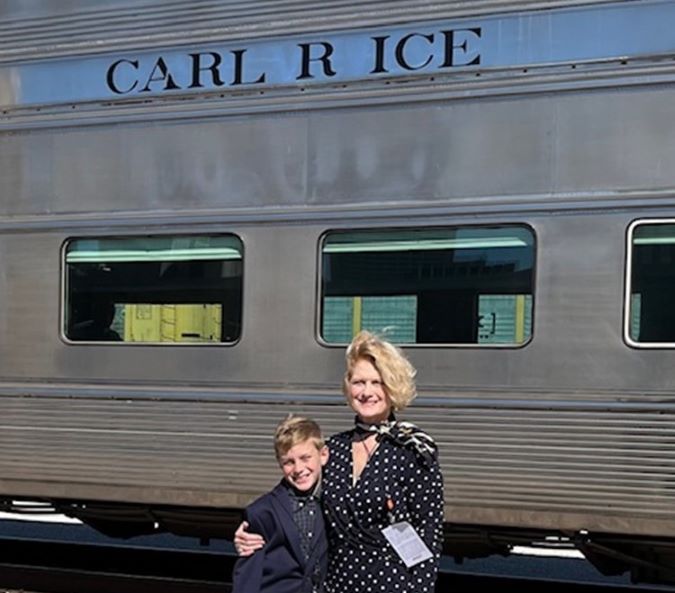 Ombudsman, Mignon Lambley, and her son on a train trip