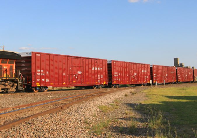A BNSF train moves packaged sugar in boxcars. 